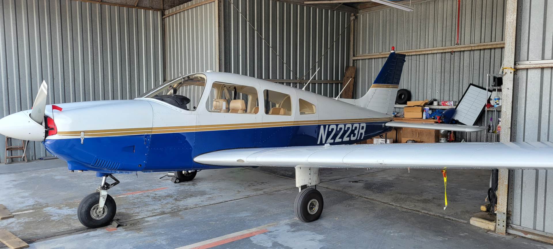 N2223R side profile inside the club hangar
